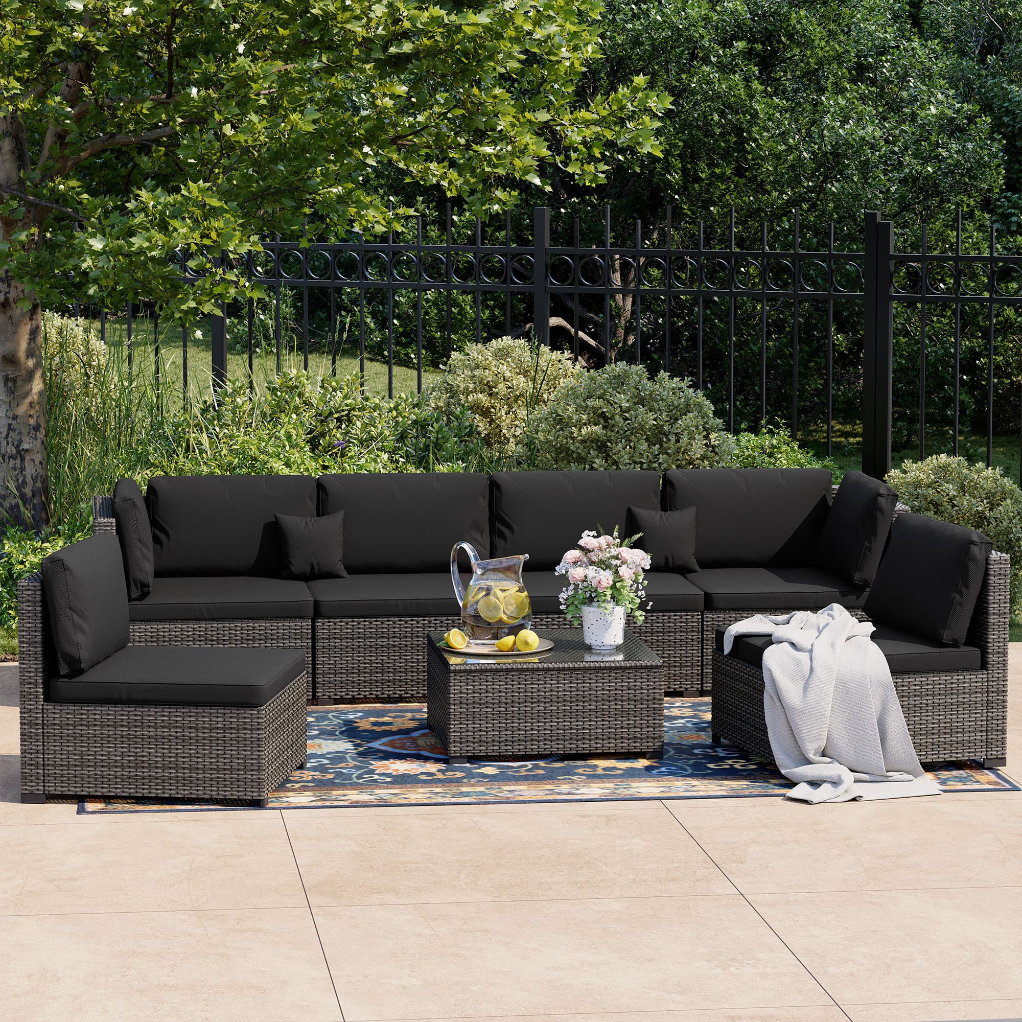 7-Piece Rattan Patio Furniture Set Arranged on Backyard Deck?